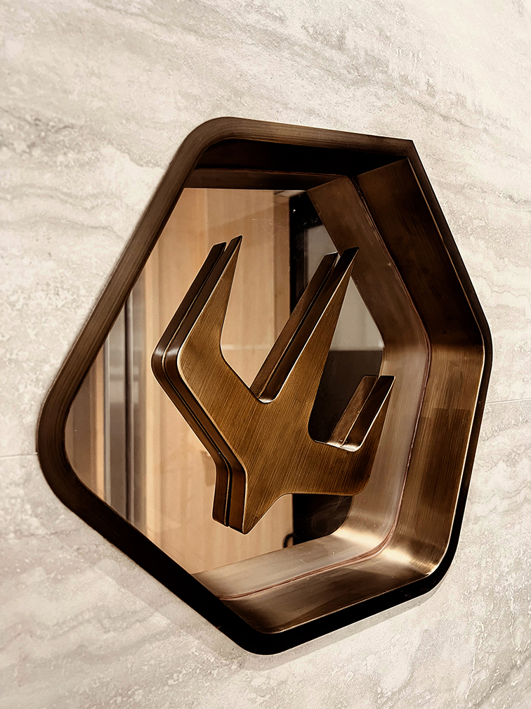 Charterama Office Renovation with tile, wood louvers and stainless steel signage